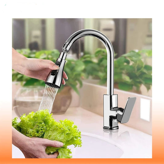 Person washing lettuce under a modern kitchen faucet with a blurred indoor background
