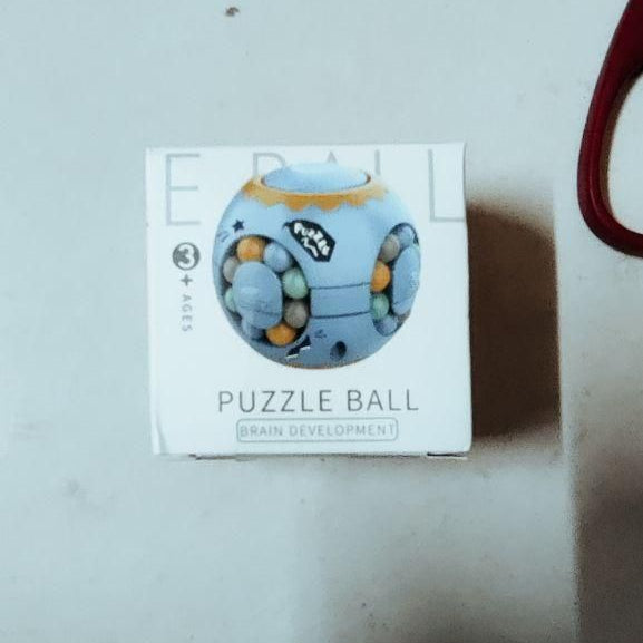 Puzzle Ball packaging on a light gray surface