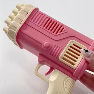 Pink toy gun with beige accents on a light gray background