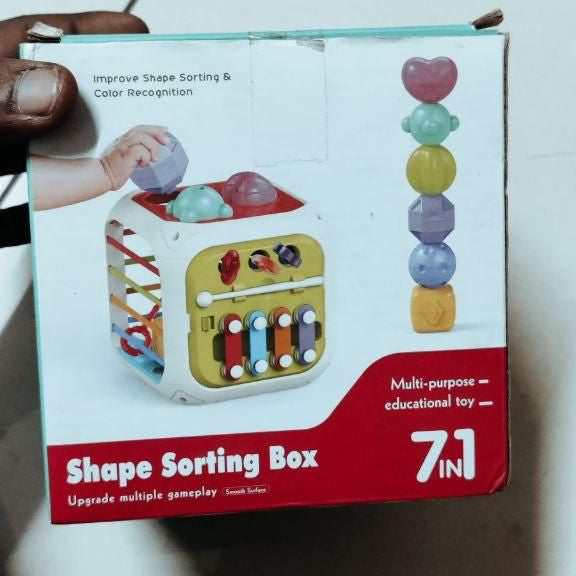 Box of a Shape Sorting Box on a tiled floor